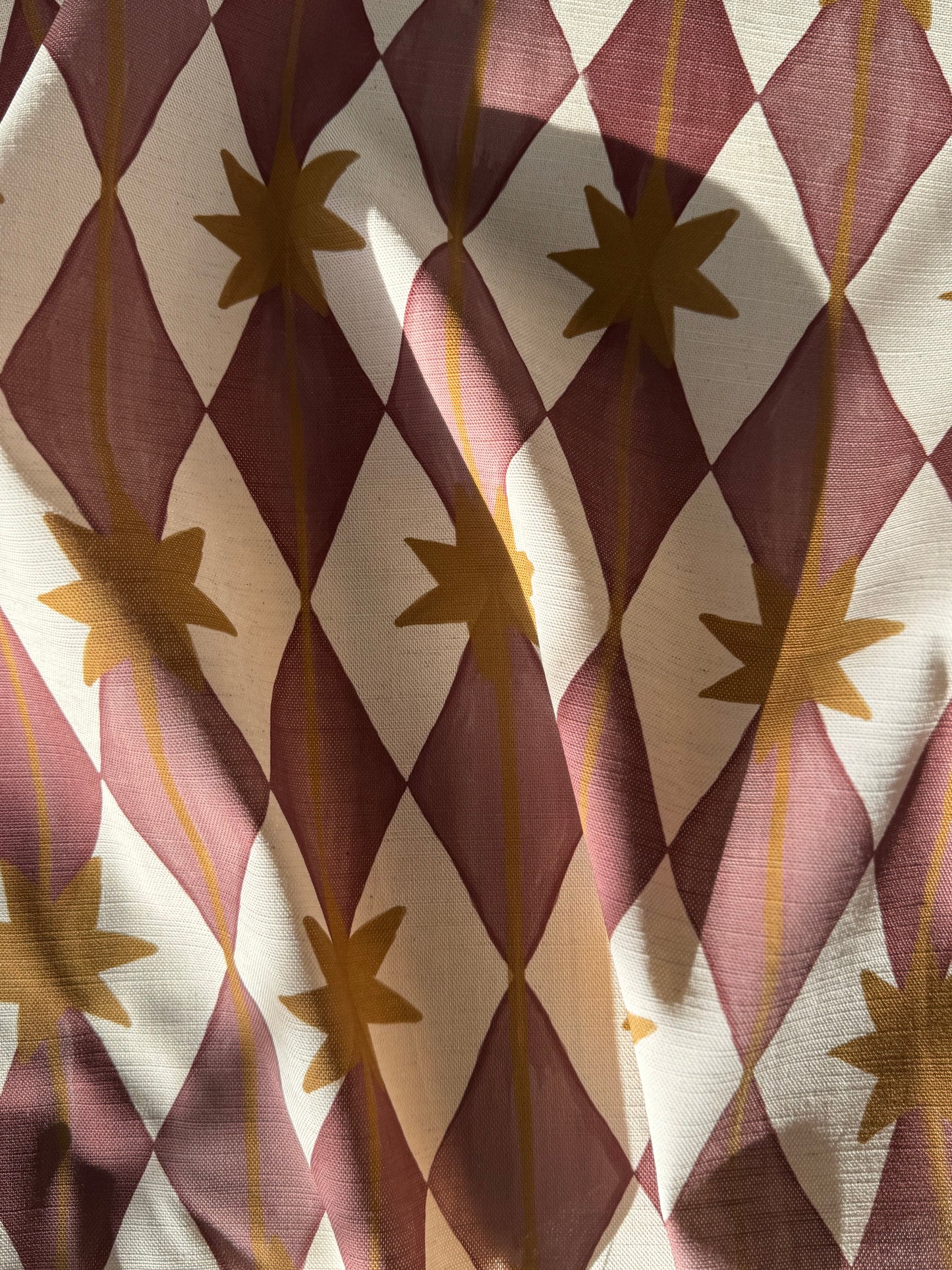 Starfall printed cotton, linen union fabric in Raspberry