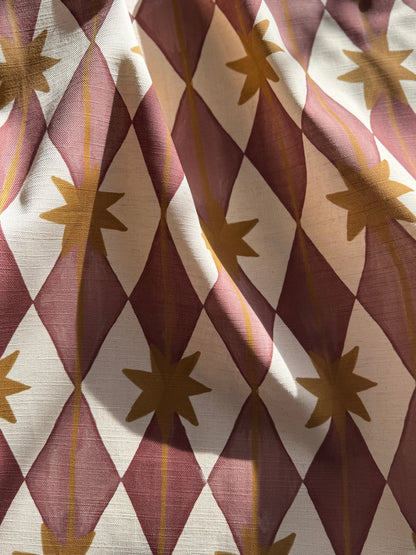 Starfall printed cotton, linen union fabric in Raspberry