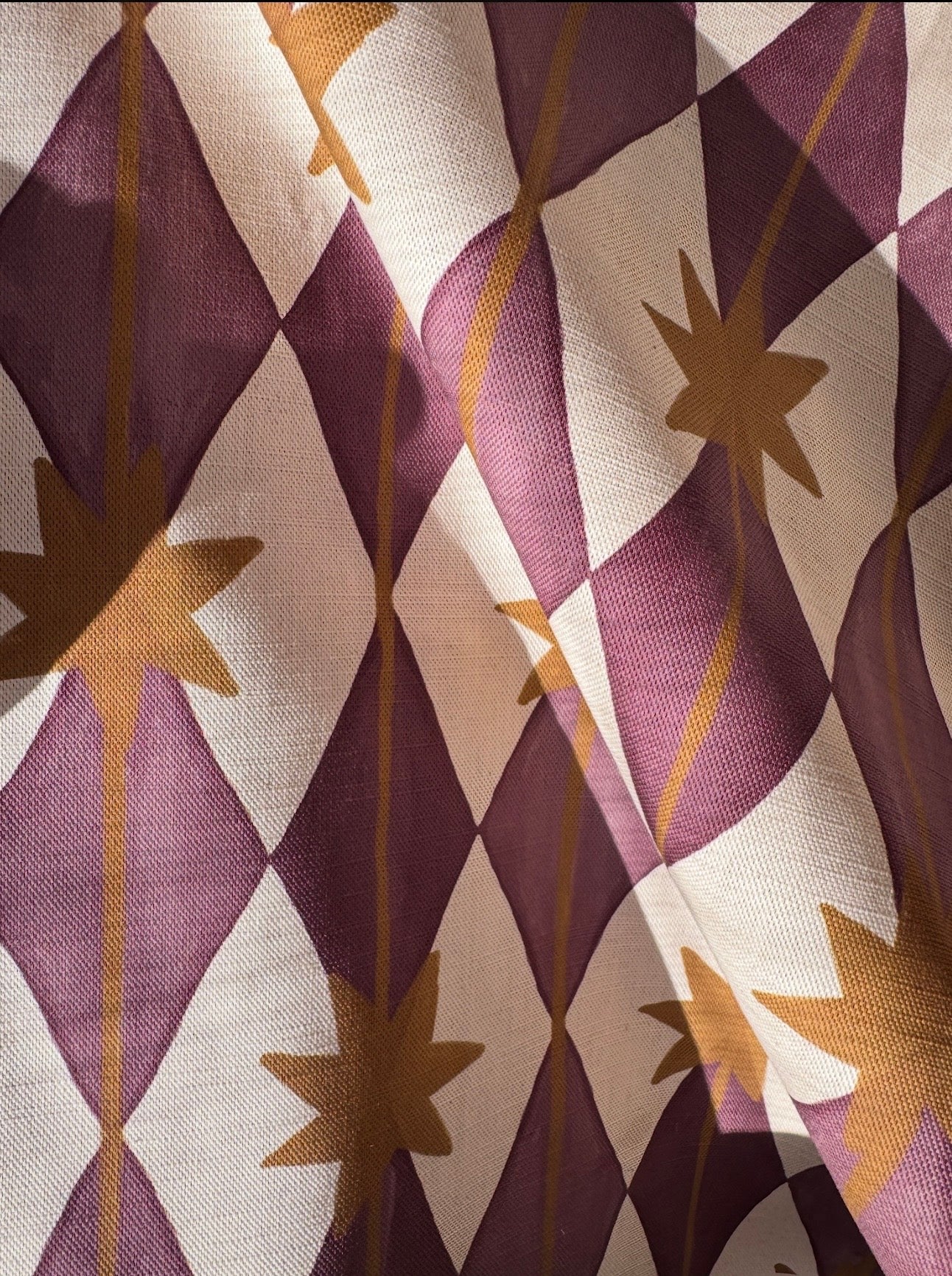 Starfall printed cotton, linen union fabric in Blackcurrant